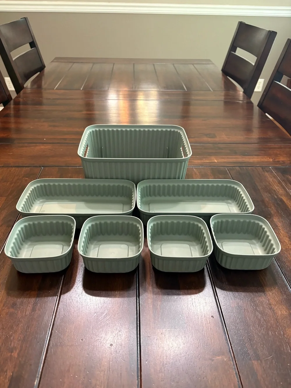 Set of 7 sage green plastic storage containers
